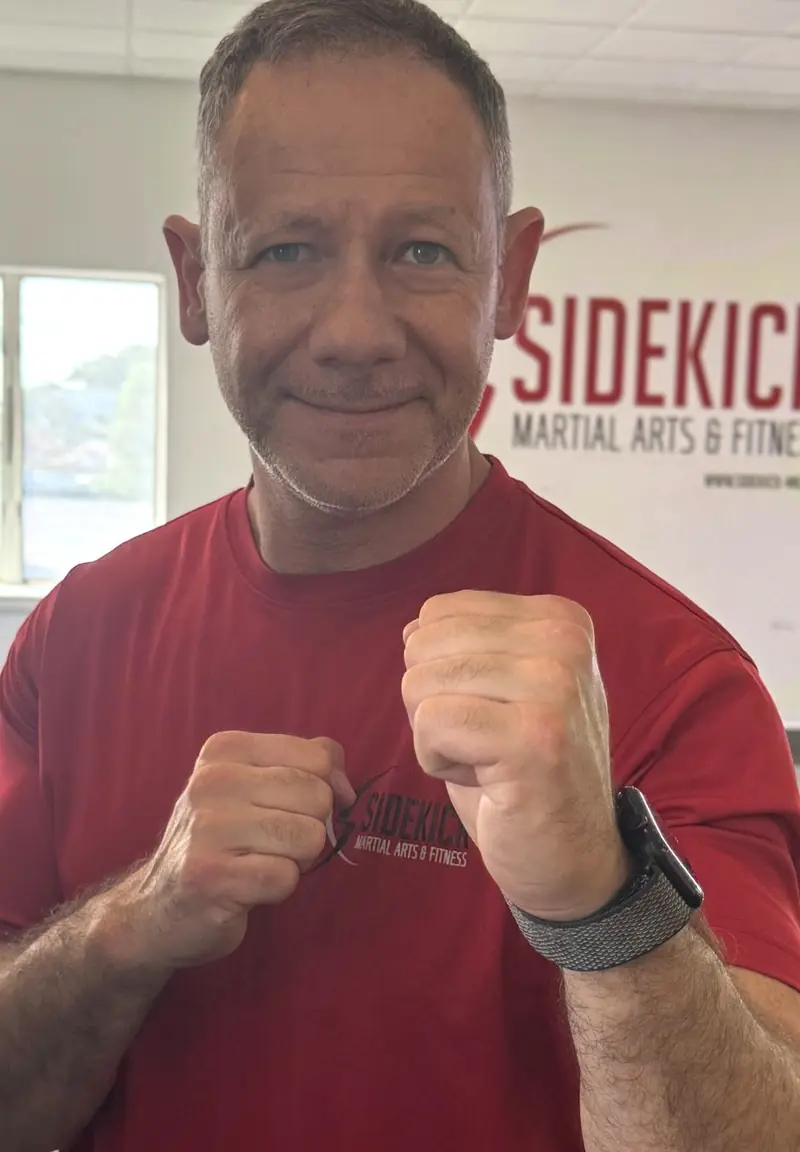 Joe Tabakhman, certified personal trainer and 6th degree black belt, in the Sidekick Strong studio