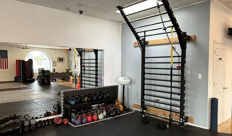 Kettlebells and stall bars in the Sidekick Strong private studio, Hasbrouck Heights NJ